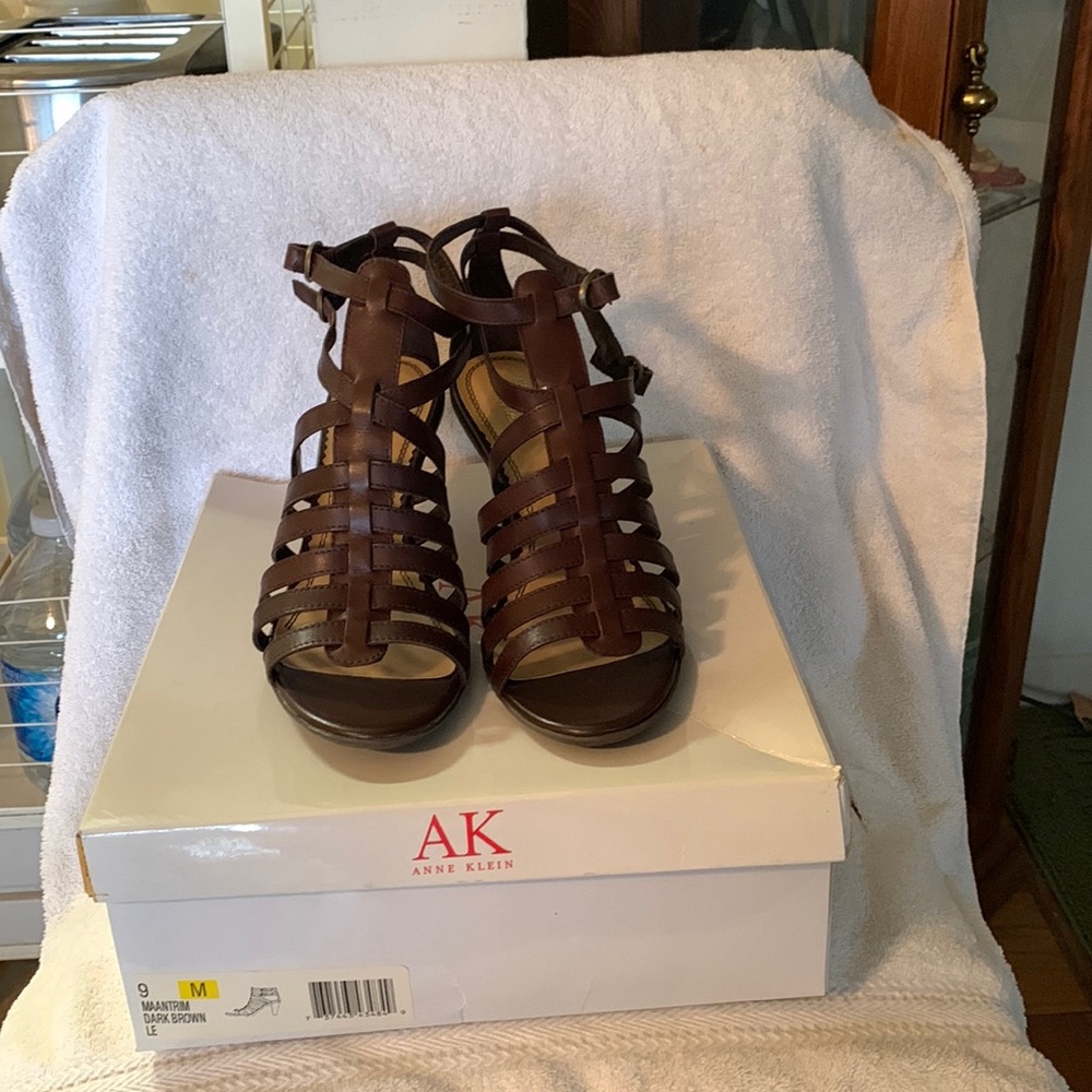 Brown sandals with a heel about 2 inch high.